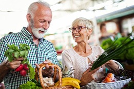 Couple at the store buying vegetables