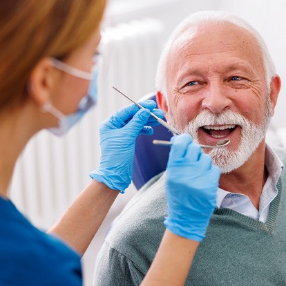 Mature man smiling during dental checkup