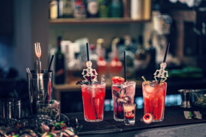 Halloween-themed cocktails sitting on a bar top